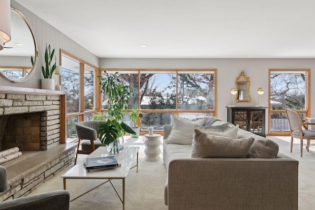 living room featuring a brick fireplace