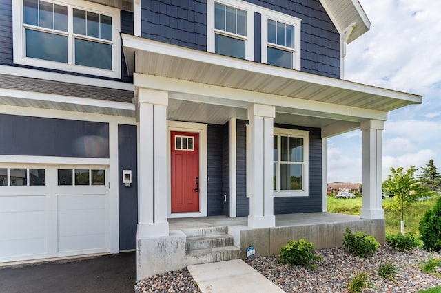 view of exterior entry with covered porch