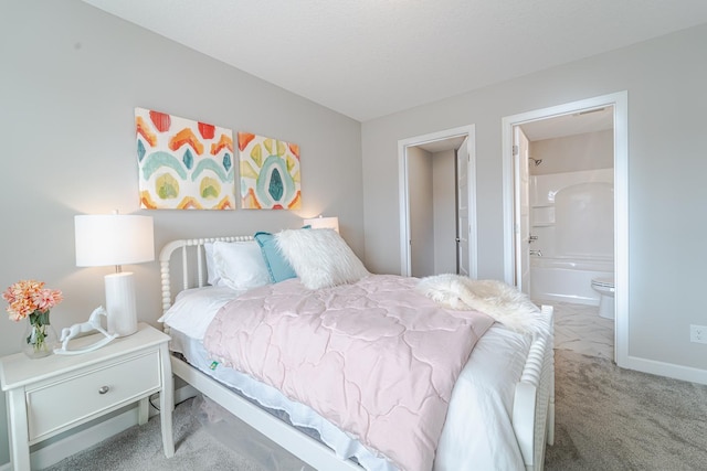 carpeted bedroom featuring ensuite bathroom