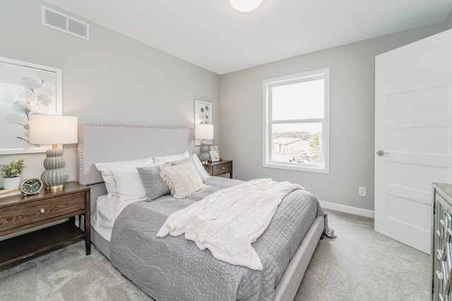 bedroom with light carpet