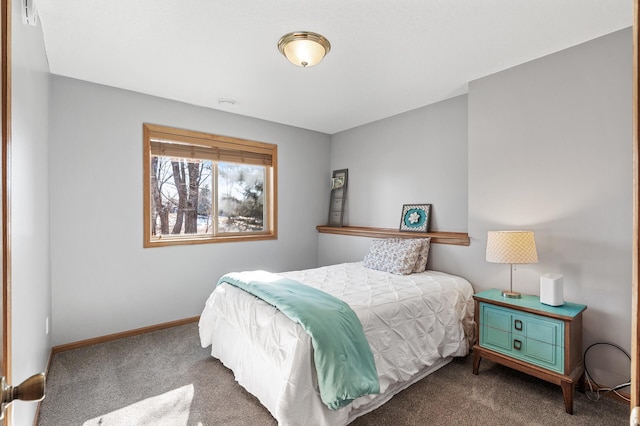 bedroom featuring baseboards and carpet