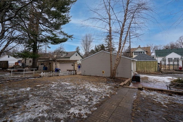 back of house featuring fence and a residential view