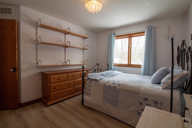 bedroom with light hardwood / wood-style floors