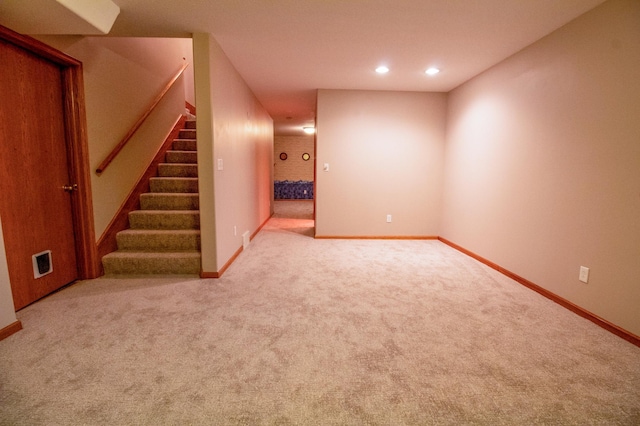 basement with light colored carpet