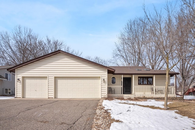 single story home featuring a porch, an attached garage, driveway, and roof with shingles