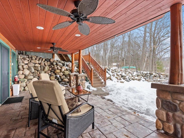 view of patio / terrace with stairs and ceiling fan