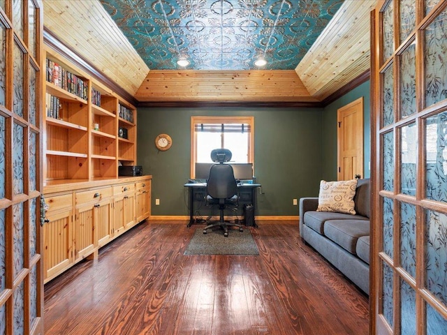 office space featuring baseboards, dark wood finished floors, and crown molding