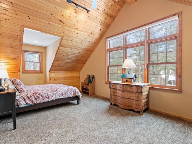 bedroom featuring carpet flooring, lofted ceiling, baseboards, wood ceiling, and wood walls