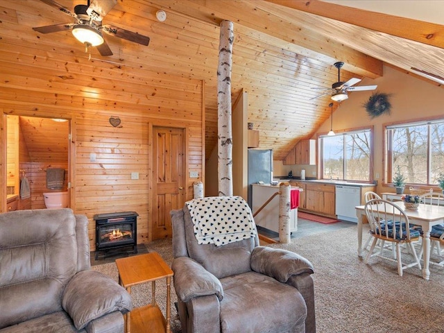 living area with ceiling fan, wooden walls, and light carpet