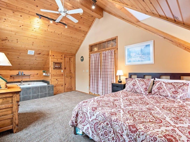 bedroom with carpet flooring, vaulted ceiling, track lighting, wooden walls, and wood ceiling