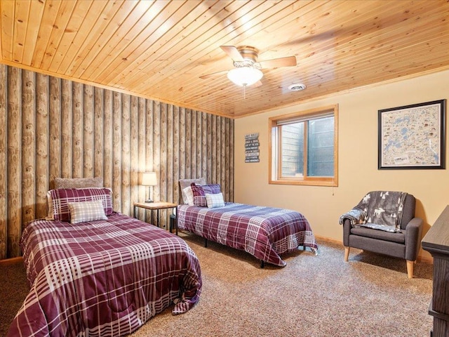carpeted bedroom with wood ceiling and a ceiling fan