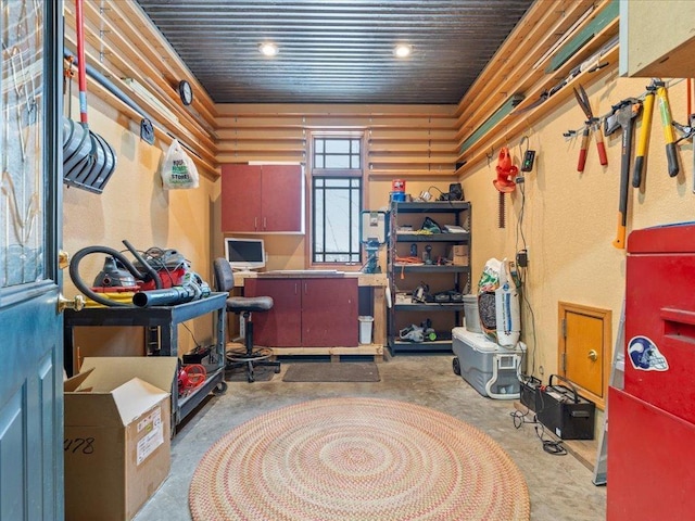 office with unfinished concrete flooring