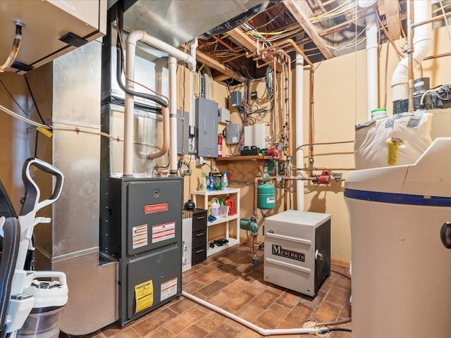 utility room with electric panel and heating unit