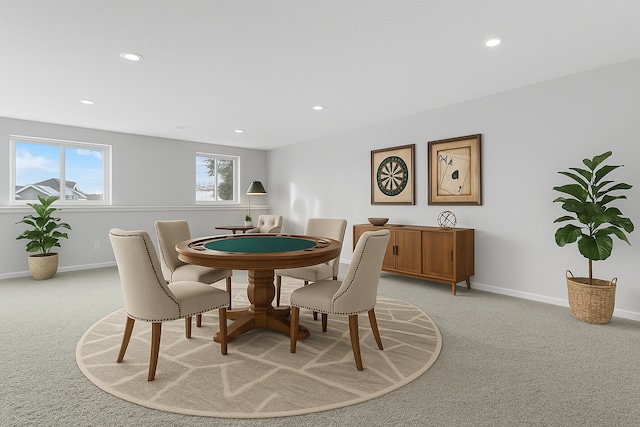 dining space featuring light carpet, recessed lighting, and baseboards
