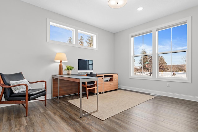 office featuring baseboards, healthy amount of natural light, wood finished floors, and recessed lighting