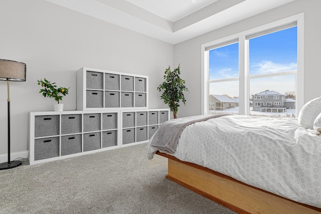 bedroom featuring carpet flooring and baseboards