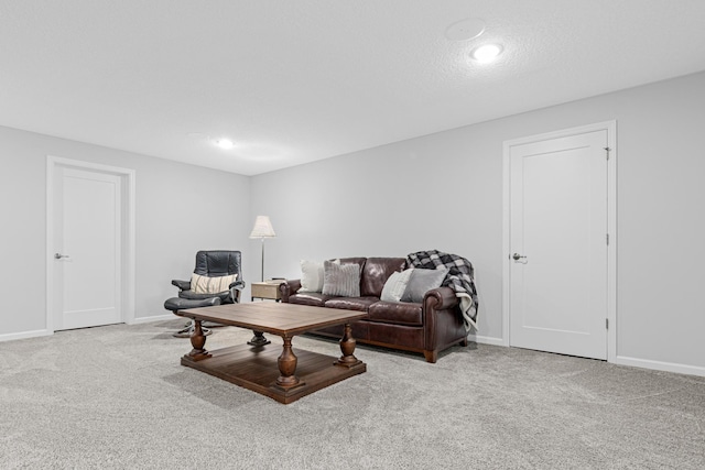 carpeted living room with baseboards and recessed lighting