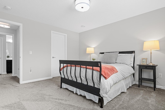 carpeted bedroom with baseboards