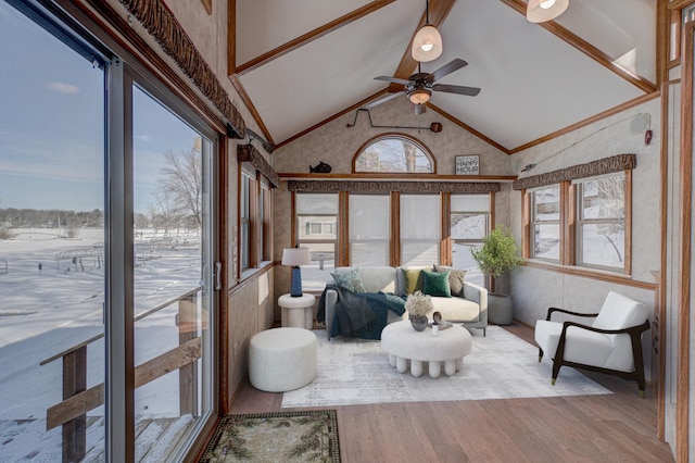 sunroom / solarium featuring ceiling fan and lofted ceiling