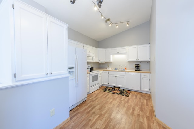 kitchen featuring sink, white appliances, light hardwood / wood-style flooring, white cabinets, and vaulted ceiling