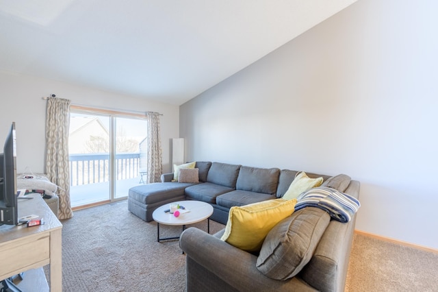 carpeted living room with lofted ceiling