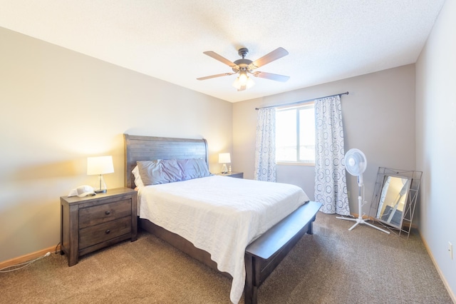 carpeted bedroom with ceiling fan and a textured ceiling