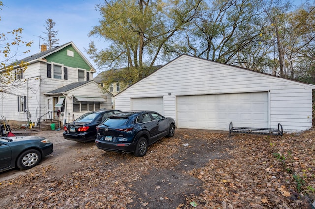 exterior space with an outbuilding and a garage