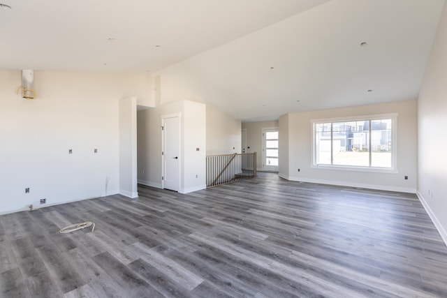 1705 Brandt Dr NE, Byron, MN 55920 - unfurnished living room with dark hardwood / wood-style flooring and vaulted ceiling