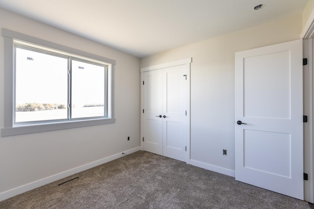 1705 Brandt Dr NE, Byron, MN 55920 - unfurnished bedroom with a closet and carpet flooring