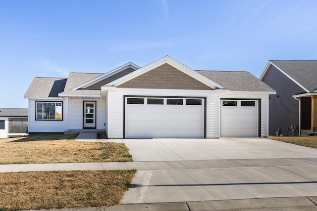 1705 Brandt Dr NE, Byron, MN 55920 - view of front of house featuring a garage and a front yard
