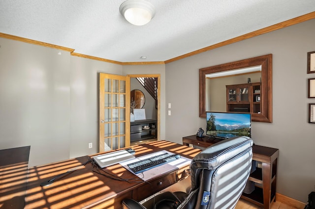 home office featuring a textured ceiling and crown molding