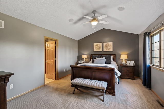 bedroom featuring baseboards, vaulted ceiling, a textured ceiling, and light colored carpet