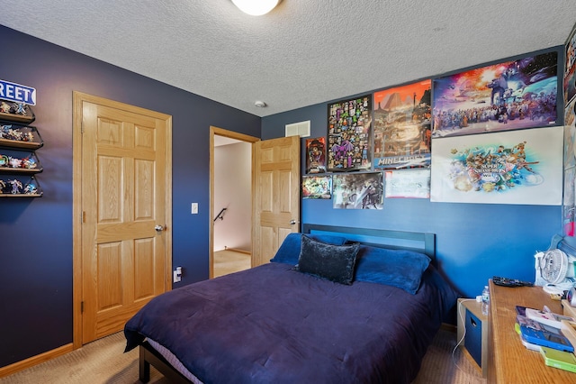 carpeted bedroom featuring visible vents and a textured ceiling