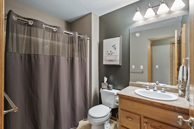 bathroom with a textured ceiling, vanity, toilet, and a shower with curtain