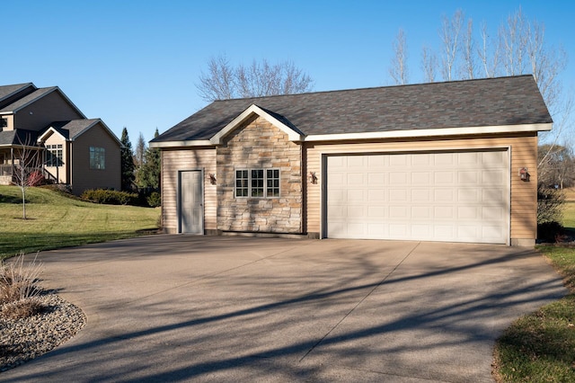 single story home with a front yard, stone siding, an attached garage, and concrete driveway