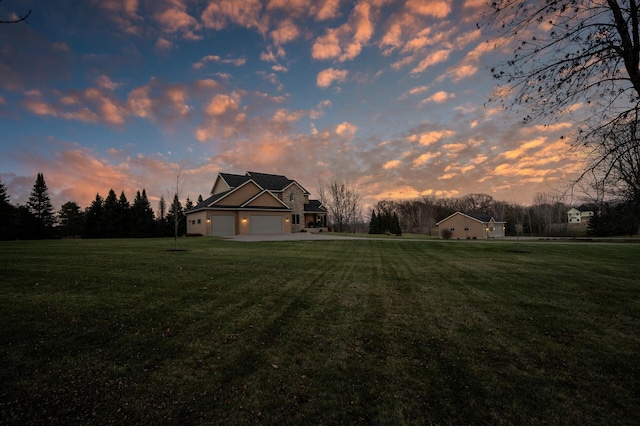 view of front of home with a garage and a front yard