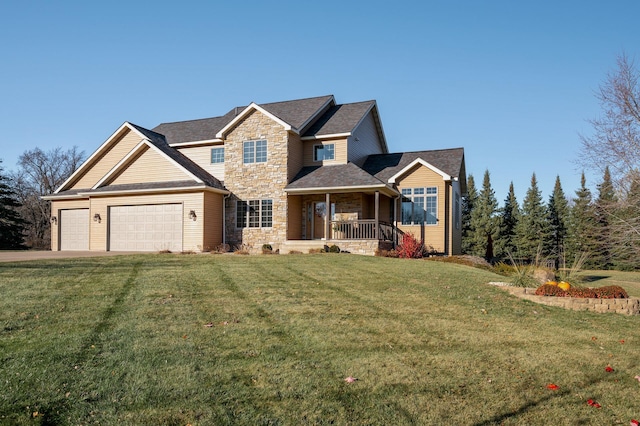 view of front facade featuring an attached garage, covered porch, stone siding, driveway, and a front lawn