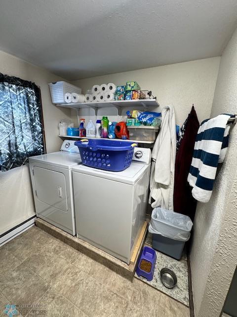 washroom with washer and dryer