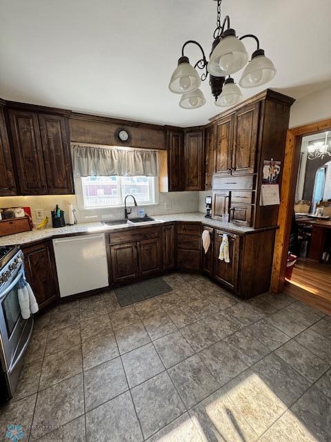 kitchen with pendant lighting, sink, dark brown cabinetry, white dishwasher, and an inviting chandelier