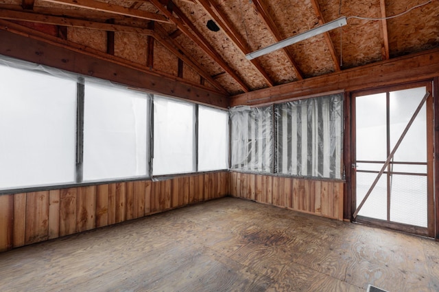 unfurnished sunroom with vaulted ceiling