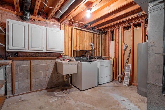 basement with washing machine and dryer, gas water heater, and sink