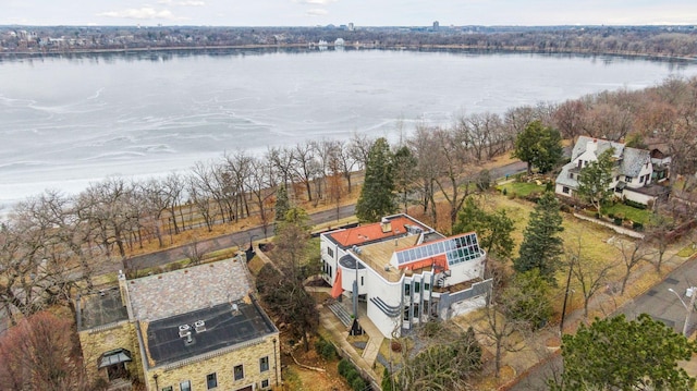 birds eye view of property with a water view