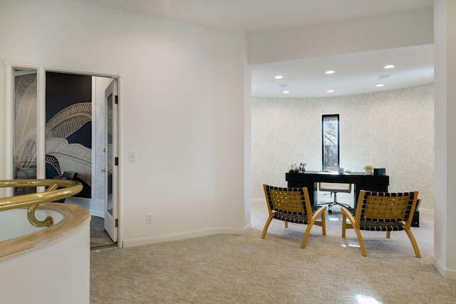 sitting room with light colored carpet