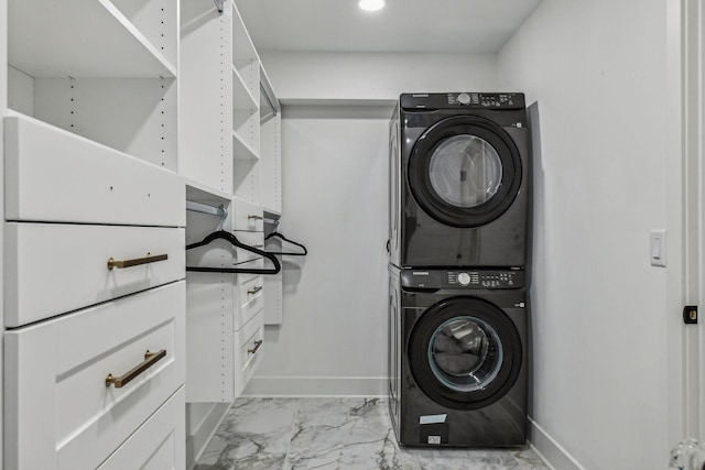 laundry room with stacked washer and dryer