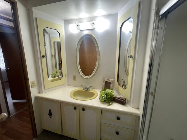 1920 Spruce Ave, Worthington, MN 56187 - bathroom featuring vanity and wood finished floors
