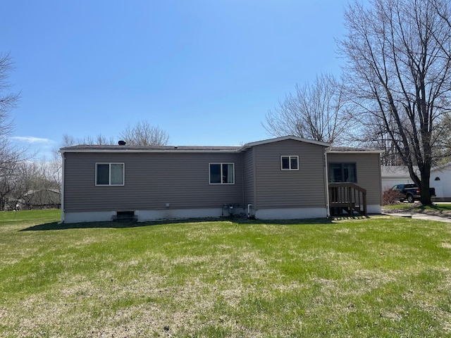 1920 Spruce Ave, Worthington, MN 56187 - back of house with a lawn