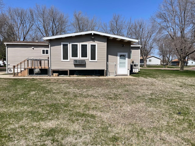 1920 Spruce Ave, Worthington, MN 56187 - back of property featuring a lawn and a deck