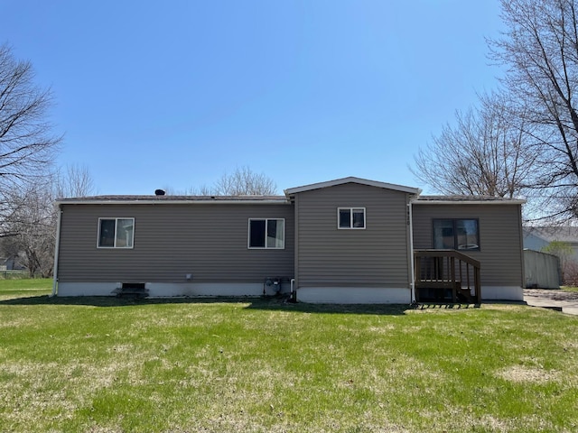 1920 Spruce Ave, Worthington, MN 56187 - back of house featuring a lawn