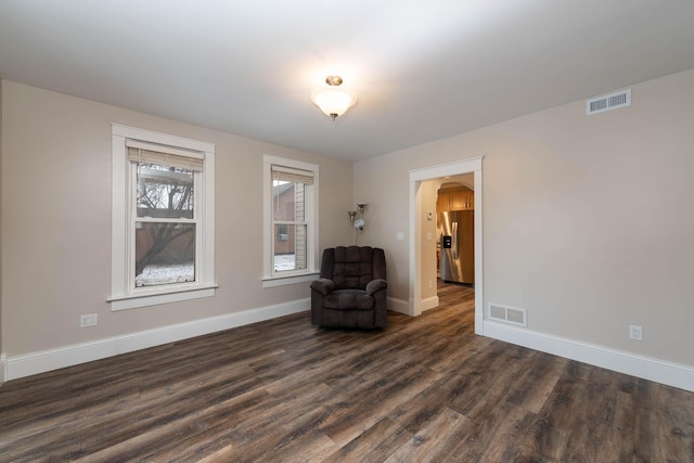 unfurnished room featuring dark hardwood / wood-style flooring