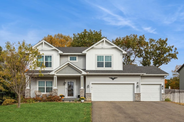 view of front of house featuring a garage and a front yard